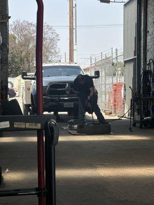 Employee changing out the tire. From light duty Dodge Ram 5500.