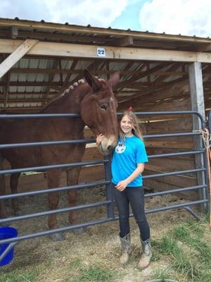 Megan with Maximus, a giant mule.