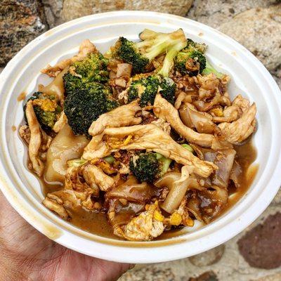 Pad See Eew~Pan fried wide rice noodles, with chicken and broccoli in a sweet soy