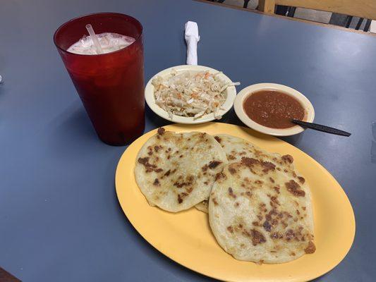 These here are 4 ( popusas-revueltas) came with a side of tomato sauce ( not spicy) and a mixture of pickled cabbage