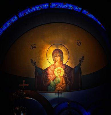 Apse icon illuminated by the setting sun