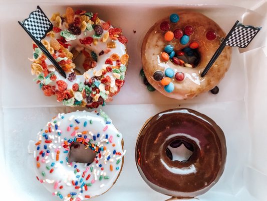 Fruity Pebble Donut, M&M donut, cake donut with sprinkles, chocolate glazed donut