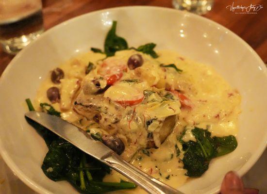 The GRILLED SEA BASS with artichoke cream sauce, saffron rice + sautéed spinach...loved it except for the cream!