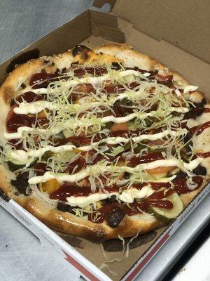 Cheeseburger pizza!  Ground beef, American cheese, tomato, pickle, lettuce, ketchup and mayo! It's a must try!!