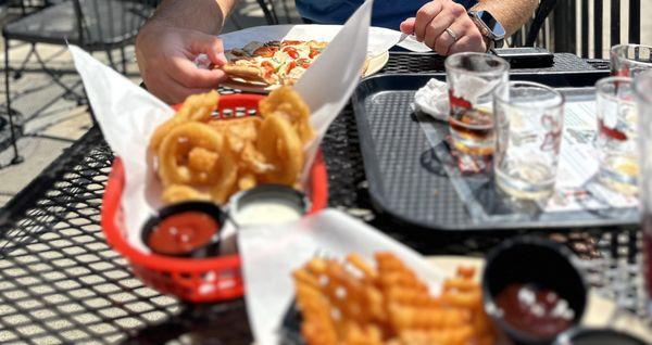 Onion rings, chicken strips, pizza (beer tasters are empty because I didn't want to be rude, so we watered the trees with the beer)