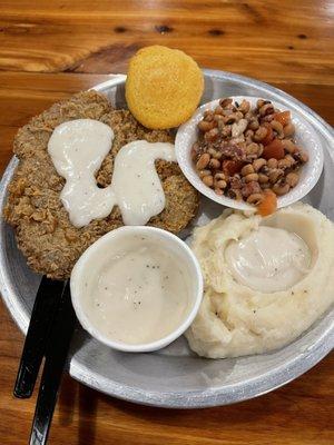 Chicken fried steak with mashed potatoes and black eyed peas and some of the best country gravy I've ever had.