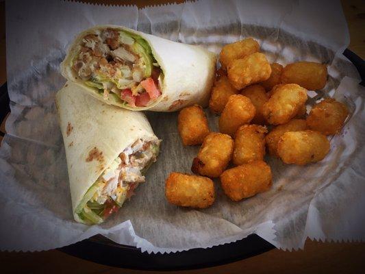 Chicken Ranch Wrap: crispy chicken, tomatoes, pickles, lettuce & onion with a 1/2 order of tater tots. Perfect for lunchtime!!