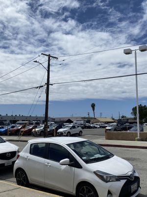 Large lot with extensive selection of cars across the street.