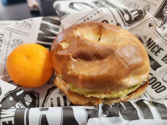 Egg, provolone, avocado, and tomato breakfast sandwich