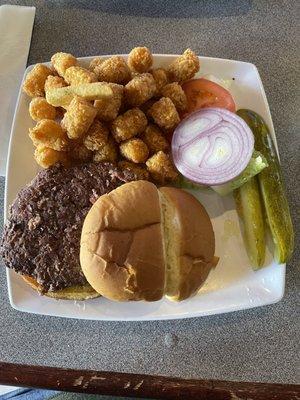 Lunch special burger with tots.