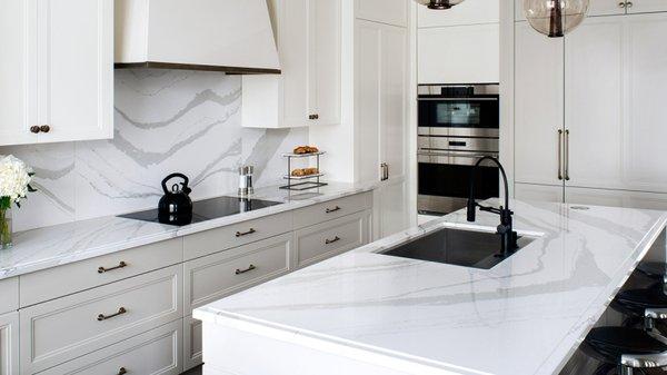 Class up your kitchen with custom white cabinets.  Love the full backsplash!