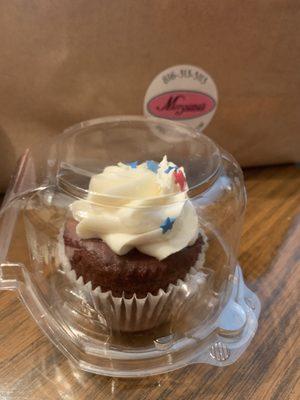 Red velvet cupcake with cream cheese icing.