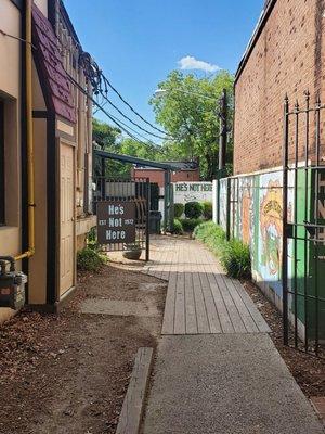 Entrance. It's down the alley and through the yard. But, you didn't hear that from me...