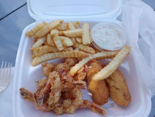 Fried shrimp dinner with fries and coleslaw