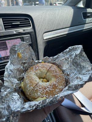 Salt bagel with egg and cheese