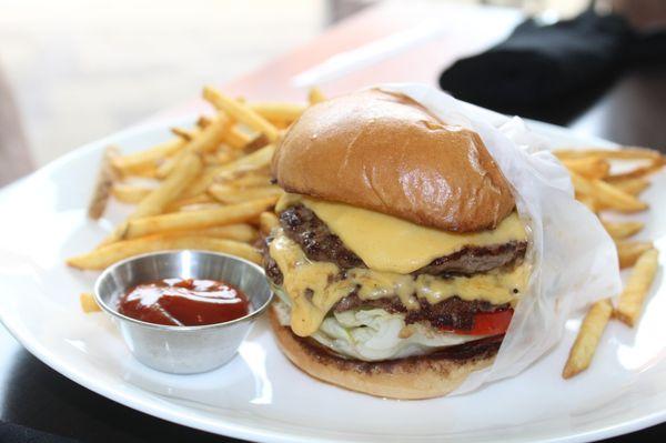 The Burger ($18) a double patty, lettuce, tomato, American cheese and house spread with shoestring fries