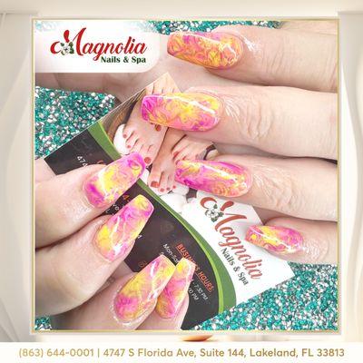 Embrace a unique style with marble pink and yellow nails, blending elegance with vibrant charm.