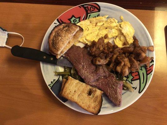 Steak and greens with scrambled eggs