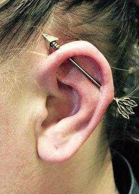 Industrial piercing done with arrow jewelry.