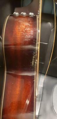 to show an angle of the mold and mildew and busted strings on a brand new Taylor 12 string guitar.