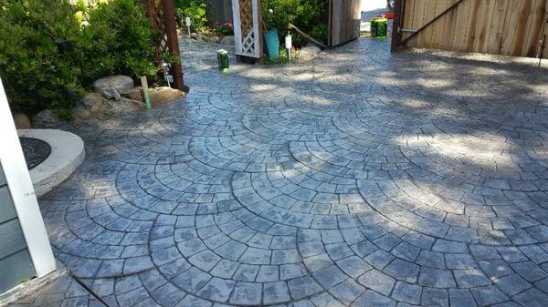 A beautiful concrete patio in a European fan stamp. For that old world charm