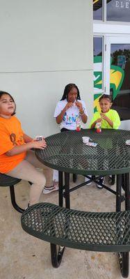 Campers enjoying a delicious snack.