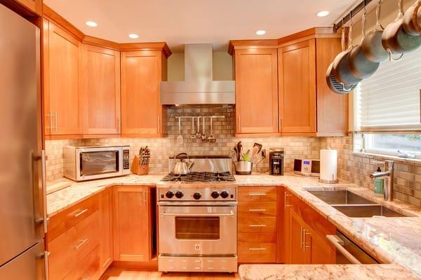 All Of Our Condos Feature Gourmet Kitchens With Cherry Wood Cabinets, Gas Range, And Stocked Cookware And Utensils.