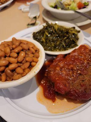 Meatloaf, collard greens, baked beans and a salad.