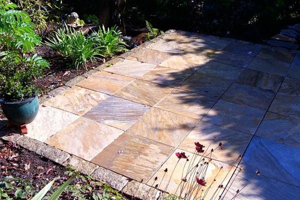 The patio was made of dimensional Gold Rush and Holcomb granite border.