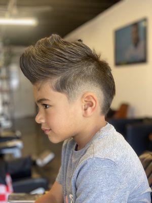 Burst fade and Mohawk styled by Bryan