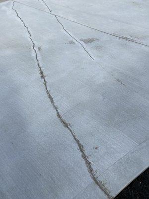 The crack that he tried to repair on a new driveway.