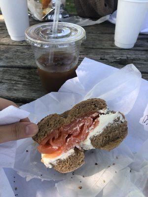 Lox and cream cheese on an everything wheat bagel