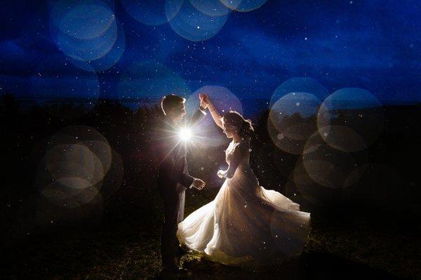 A groom twirls his bride at a Camden Maine wedding. Photo by Kate Crabtree Photography.