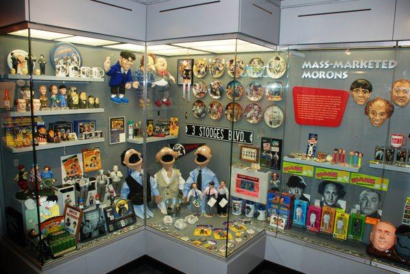 Mass-Marketed Morons is a display at The Stoogeum featuring mass produced merchandise from the late 20th century.