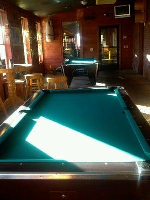 Two pool tables located in our billiard room.