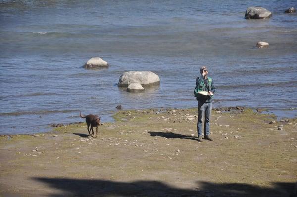 Ben and Kiddo measuring a tree from the shore of Lake Tahoe.