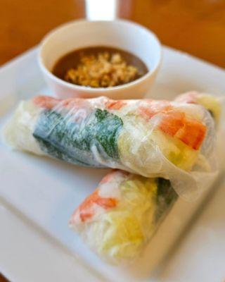 Shrimp summer roll with salad and peanut sauce. Cool and refreshing.