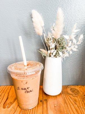 Chai iced tea latte with oat milk and a shot of espresso.