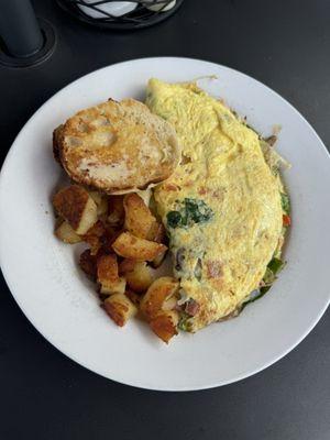 Western omelette with spinach and mushrooms added comes with home fries and choice of bread