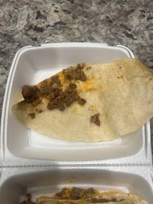 This is a whole half of a quesadilla. Don't go here. The street vendors are better and deserve our money, not this place.