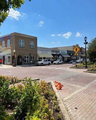 Street view from across the square. You know you are there when you get to the yellow striped awning!