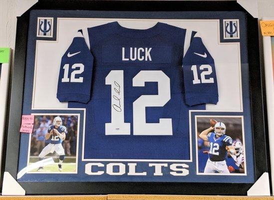 We carry football memorabilia like this signed & framed Andrew Luck jersey.