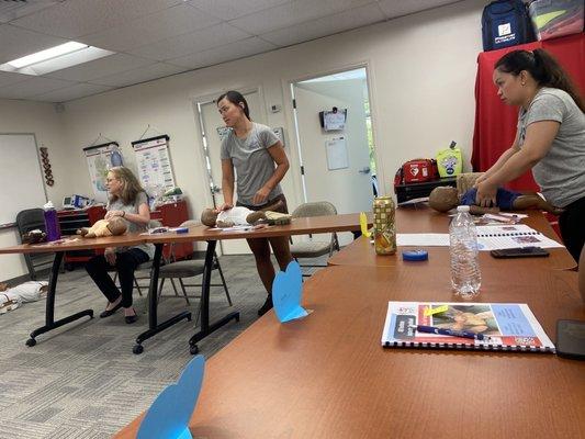 The Class is learning how to do CPR on babies