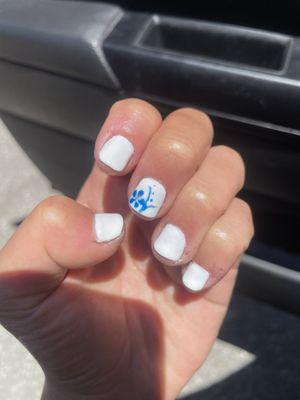 gel manicure with blue flower design