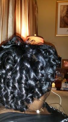 She asked me how would I like my hair curled. I told her very tight and she put it tight and is a lot of curls.