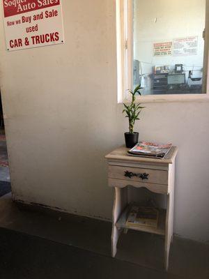 They have a little waiting area with three chairs  kind of cute!