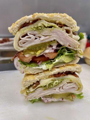 Magic Mike
( turkey, bacon, pesto, Swiss cheese, avocado and bomb sauce) 

High recommend