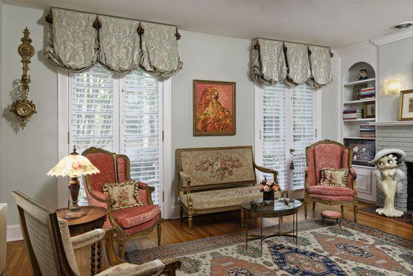 A Finalist in Soft Shade Design, 2024 Grace Awards, this traditional Living Room features Balloon valances and Silhouettes. New paint color.