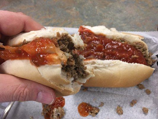 Cheese Steak  -  with American cheese, sauce, onions, pickles. The sauce is ketchup based - very tasty sandwich.