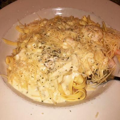 Fettuccine Alfredo with shrimp and freshly grated Parmesan cheese.